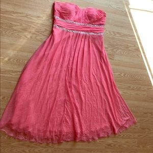 A beautiful salmon strapless event dress
